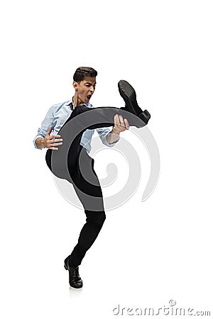 Happy young man dancing in casual clothes or suit, remaking legendary moves of celebrity from culture history Stock Photo