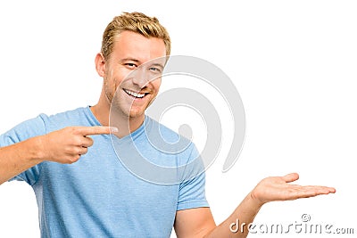 Happy young man showing empty copyspace on white background Stock Photo