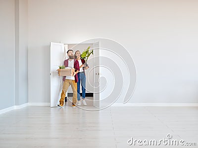 Happy young married couple moves to new apartment Stock Photo