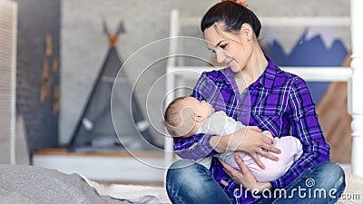 Happy Young Mother Holding Lovely Child and Kissing His Hand Medium Shot  Stock Footage - Video of admiring, asleep: 145802230