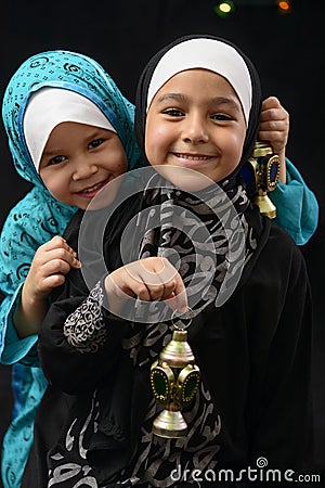 Happy Young Muslim Girls with Ramadan Lantern Stock Photo