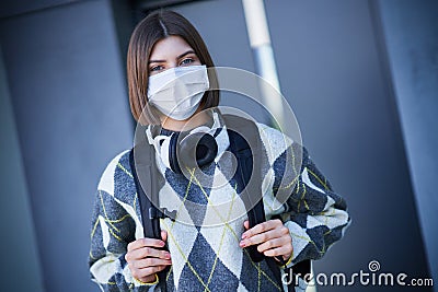 Happy young positive student posing over bright background Stock Photo