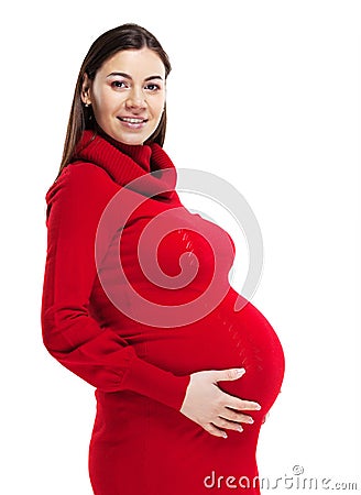 Happy young pregnant woman in red dress Stock Photo