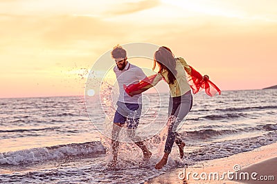 Happy young romantic couple in love have fun on beautiful beach at beautiful summer day Stock Photo