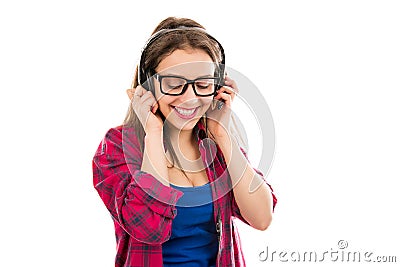 Smiling teenage woman listening to music Stock Photo