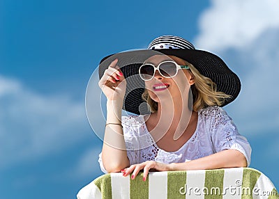 Happy young woman on the beach, beautiful female face outdoor portrait, pretty healthy girl relaxing outside, nature fun and joy, Stock Photo