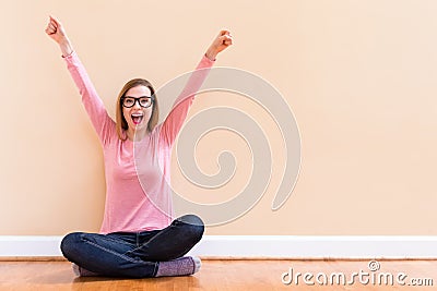 Happy young woman cheering Stock Photo