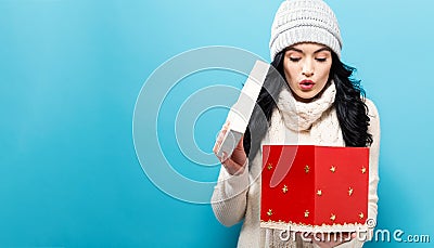 Happy young woman with Christmas present box Stock Photo