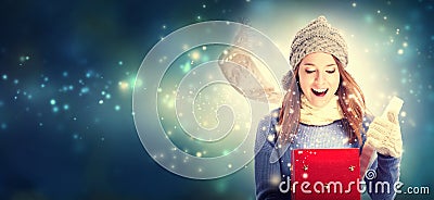 Happy young woman with Christmas present box Stock Photo