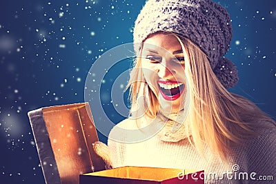 Happy young woman with Christmas present box Stock Photo