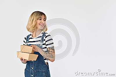 Happy young woman customer holding lunch boxes excited with fast food delivery. Stock Photo