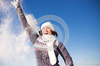 Happy young woman have fun and enjoy fresh snow Stock Photo