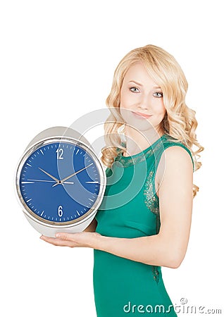 Happy young woman with horror looks at an clock on a white background. Stock Photo