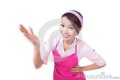 Happy young woman housewife showing Stock Photo