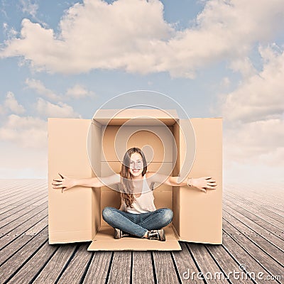 Happy young woman inside a Box Stock Photo