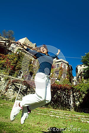 Happy young woman jumping Stock Photo