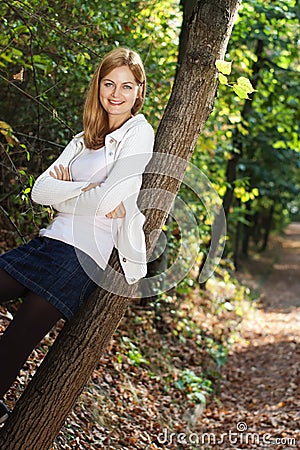 Happy young woman outdoors in the park Stock Photo