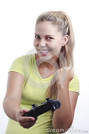 Happy young woman playing video game with joystick Stock Photo