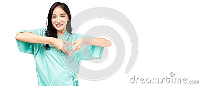 Happy young woman showing heart with two hands, love sign Cardiology patient use finger make heart shape over her chest and heart Stock Photo