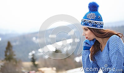 Happy young woman in ski cothes outdoors Stock Photo