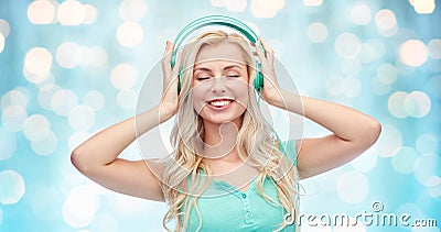 Happy young woman or teenage girl with headphones Stock Photo