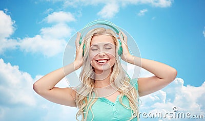 Happy young woman or teenage girl with headphones Stock Photo