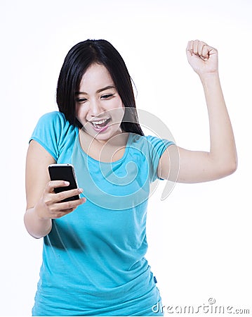 Happy young woman text messaging Stock Photo