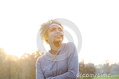 Happy young woman thinking and looking up Stock Photo