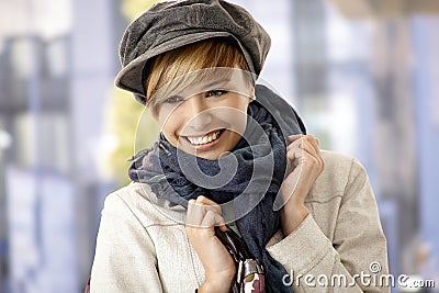 Happy young woman wearing scarf and hat Stock Photo