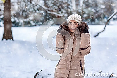 Young woman on a winter walk in winter time at nature. Stock Photo