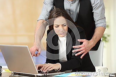 Harassment with a boss touching to his secretary Stock Photo