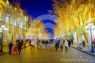 Harbin, China - February 9, 2017: Scenic view of pedestrian street decorated with beautiful christmas lights in the city Editorial Stock Photo