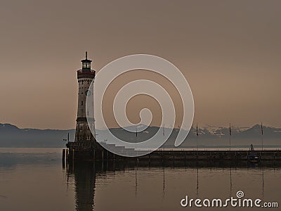 Harbor basin with famous historic Lindau lighthouse on the coast of Lake Constance, Germany. Stock Photo