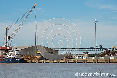 Harbor crane loading a ship with wood. Bordeaux port Editorial Stock Photo