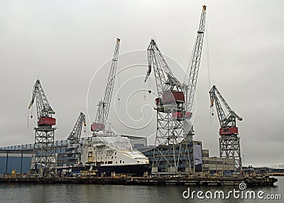 Harbor cranes in sea cargo port in Helsinki Stock Photo