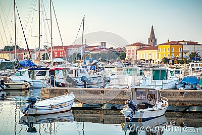 Harbor with docked boats in Porec town on Adriatic sea. Stock Photo