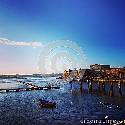 Harbor with sunken boats sunset. Stock Photo