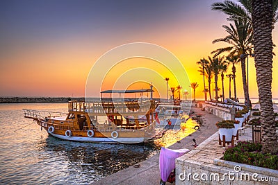 The harbour with boats in Side at sunset Stock Photo