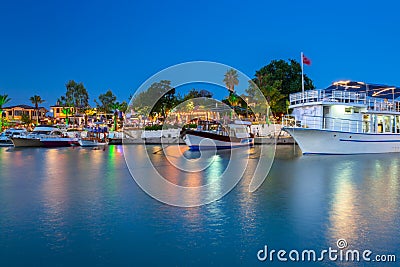 The harbour with boats in Side at night, Turkey Stock Photo