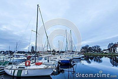 Harbour quay in historic city of Carentan,France at twilight Stock Photo