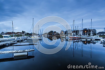 Harbour quay in historic city of Carentan, France at twilight Editorial Stock Photo