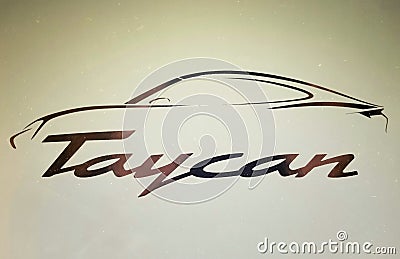The hard cover of a Porsche Taycan all-electric sedan promotional booklet Editorial Stock Photo