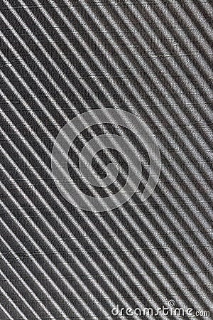 Hard diagonal shadows on grey textured wall from a window roller shutter or blinds. Attractive abstract composition Stock Photo