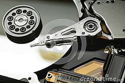 Hard disk drive internals showing read write head and platter Stock Photo