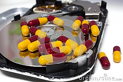 Hard disk with pill Stock Photo