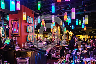 NYC Hard Rock Cafe Interior Decoration. Beautiful Multicolored Lighting and Decor, People Eating, Drinking and Enjoying Music Editorial Stock Photo