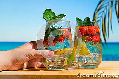 Hard seltzer cocktail on tropical beach. Stock Photo