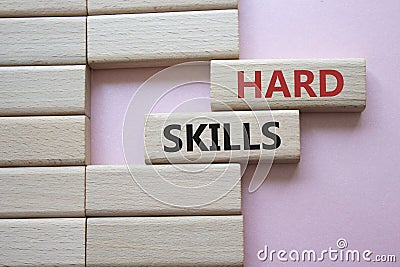 Hard skills symbol. Wooden blocks with words Hard skills. Beautiful pink background. Business and Hard skills concept. Copy space Stock Photo