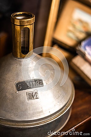 old brewing flask liquid 5 litre alcohol old vintage house items sale garage storage container uk manchester london space for text Editorial Stock Photo