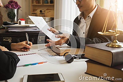 The hard work of an asian lawyer in a lawyer office. Stock Photo